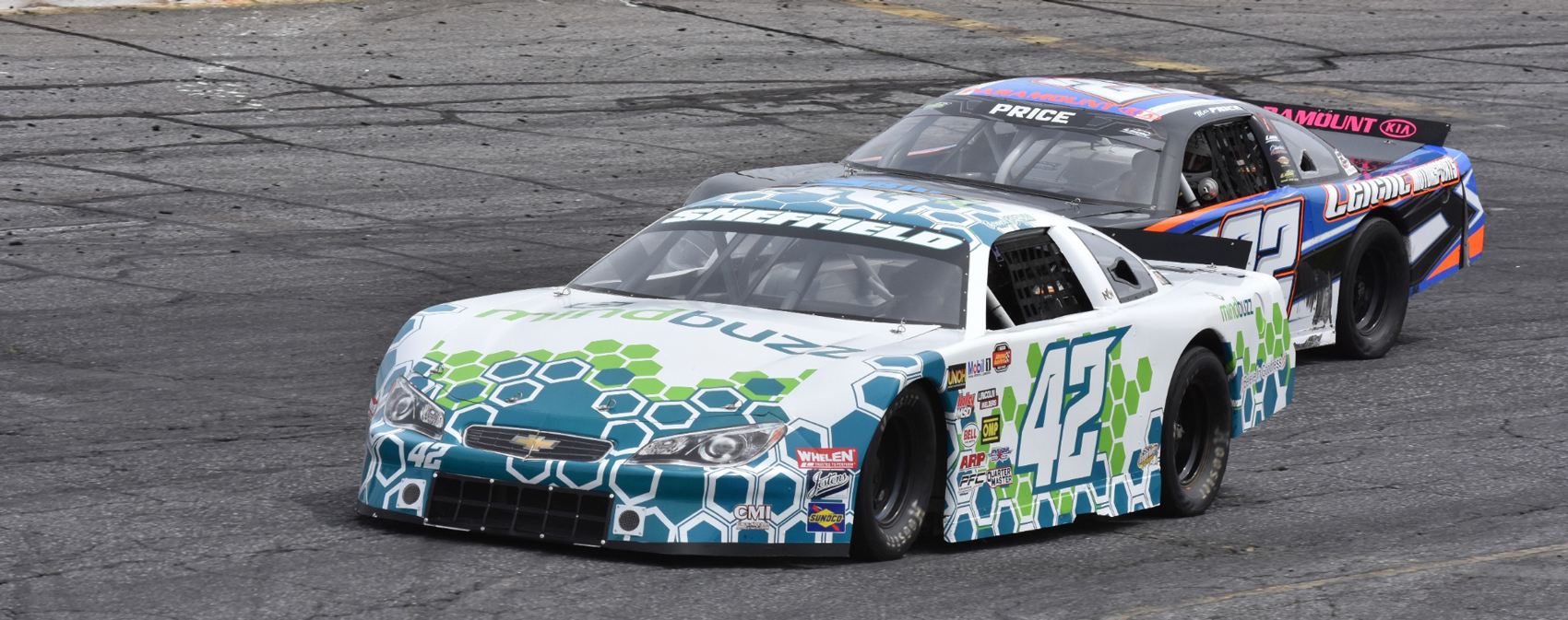 Two race cars on an asphalt track